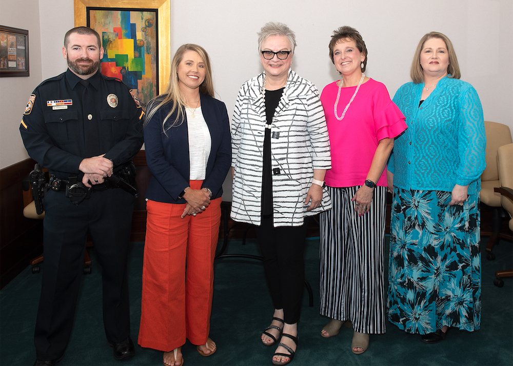 From left, Brandon Whitfield, Weslie Gray, Sharese Hurst and Shellie Armstrong were honored by President Alisa White (center) as the winners of the 2022 Staff Excellence Awards.