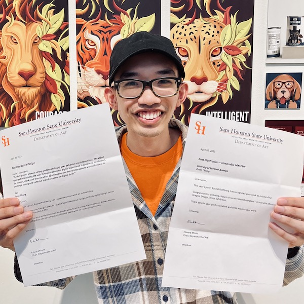 Quan Chung happily shows off his art and awards.